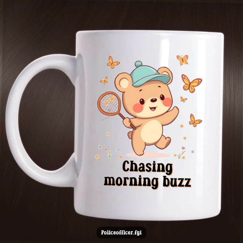 Funny Bear Cub Mug featuring a cheerful cub in a jaunty cap, happily chasing butterflies with a net, embodying pure joy.